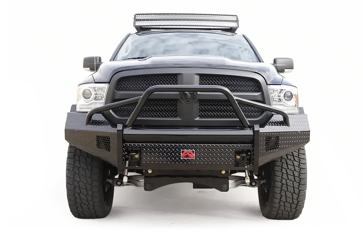 Fab Fours Black Steel diamond plate front bumper with pre-runner guard on a black Ram 1500