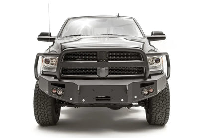 Fab Fours Premium front bumper with full guard on a black Ram 2500, straight-on front view, showing the full grille guard hoop, winch mount opening and round lights