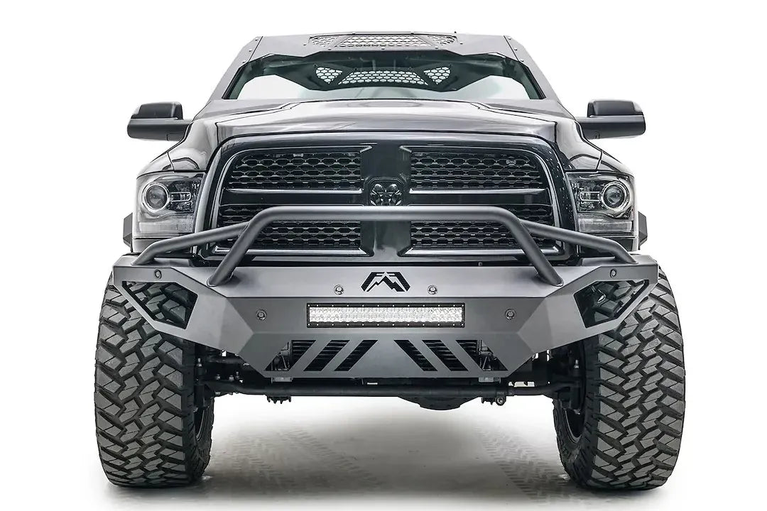 Fab Fours Open Fender front bumper on a gray lifted Ram 2500, straight-on front view, showing the pre-runner hoop, integrated light bar and slotted skid plate
