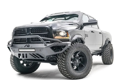 Fab Fours Open Fender front bumper on a gray lifted Ram 2500, front driver-side three-quarter view, showing the pre-runner hoop, integrated light bar and open fender cutaway