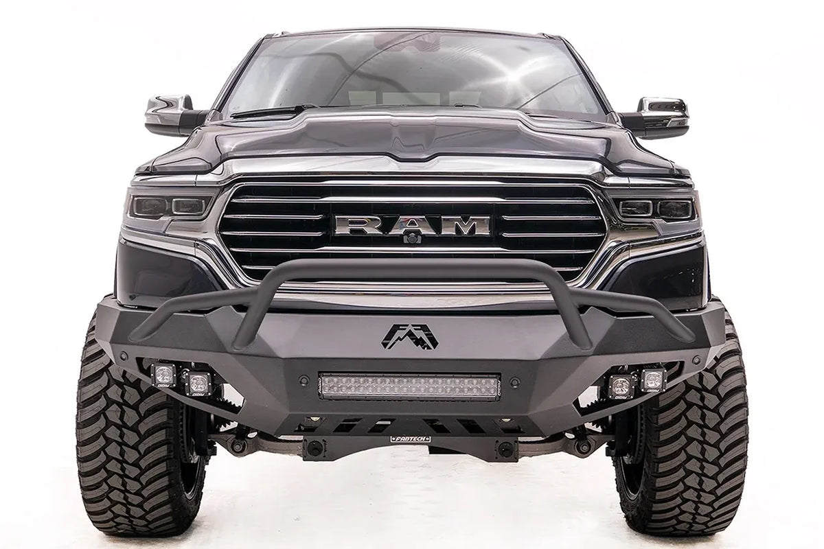 Fab Fours Vengeance front bumper with pre-runner guard on a dark gray lifted Ram 1500, straight-on front view, showing the pre-runner hoop, integrated light bar and cube lights