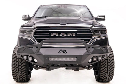 Fab Fours Vengeance front bumper with pre-runner guard on a dark gray lifted Ram 1500, straight-on front view, showing the pre-runner hoop, integrated light bar and cube lights