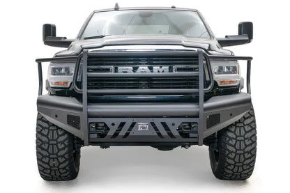 Fab Fours Black Steel Elite front bumper with full guard on a black lifted Ram 2500, straight-on front view, showing the full grille guard, Elite badge and slotted skid plate