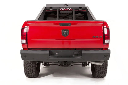 Fab Fours Red Steel rear bumper and bed chase rack on a red Ram 1500