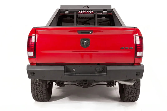 Fab Fours Red Steel rear bumper and bed chase rack on a red Ram 1500