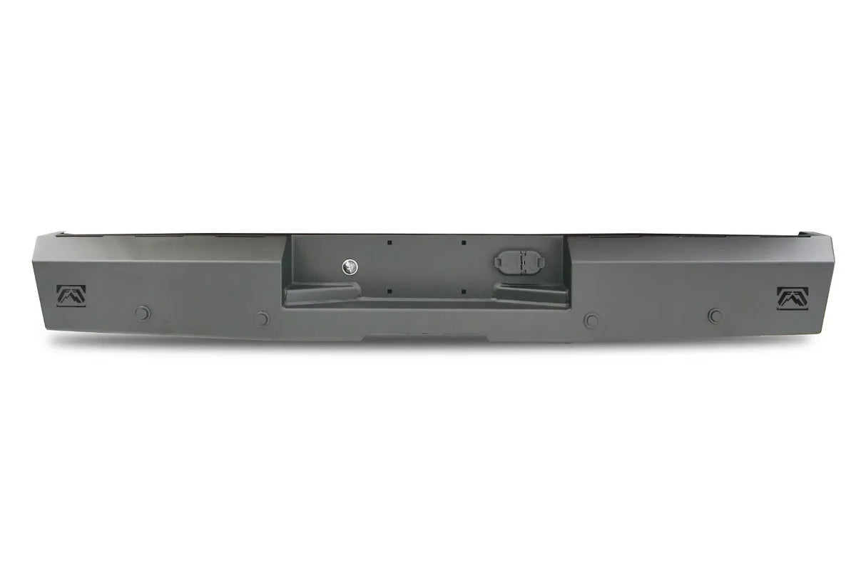 Fab Fours Red Steel rear bumper in black powder coat, rear view, showing the recessed license plate pocket, logo end cutouts and mounting holes