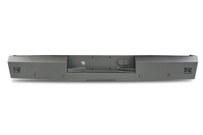 Fab Fours Red Steel rear bumper in black powder coat, rear view, showing the recessed license plate pocket, logo end cutouts and mounting holes