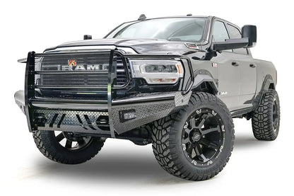Fab Fours Black Steel front bumper with full guard on a black lifted Ram 2500, front driver-side three-quarter view, showing the full grille guard, diamond-plate wings and mesh grille panel