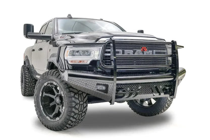 Fab Fours Black Steel front bumper with full guard on a black lifted Ram 2500, front passenger-side three-quarter view, showing the full grille guard, diamond-plate face and side wraps