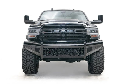Fab Fours Black Steel front bumper on a black lifted Ram 2500, straight-on front view, showing the diamond-plate face, center tube and mesh light openings