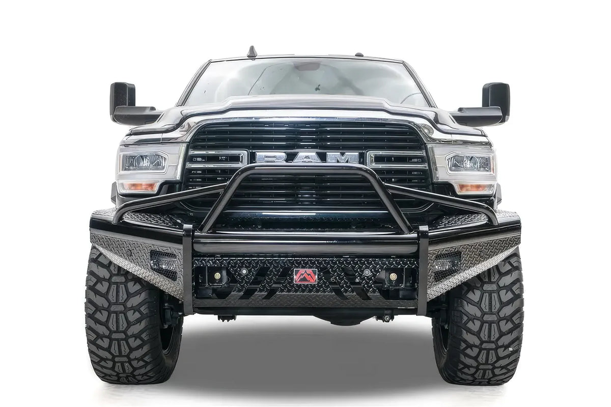 Fab Fours Black Steel front bumper with pre-runner guard on a black lifted Ram 2500, straight-on front view, showing the pre-runner hoop, diamond-plate face and red logo badge