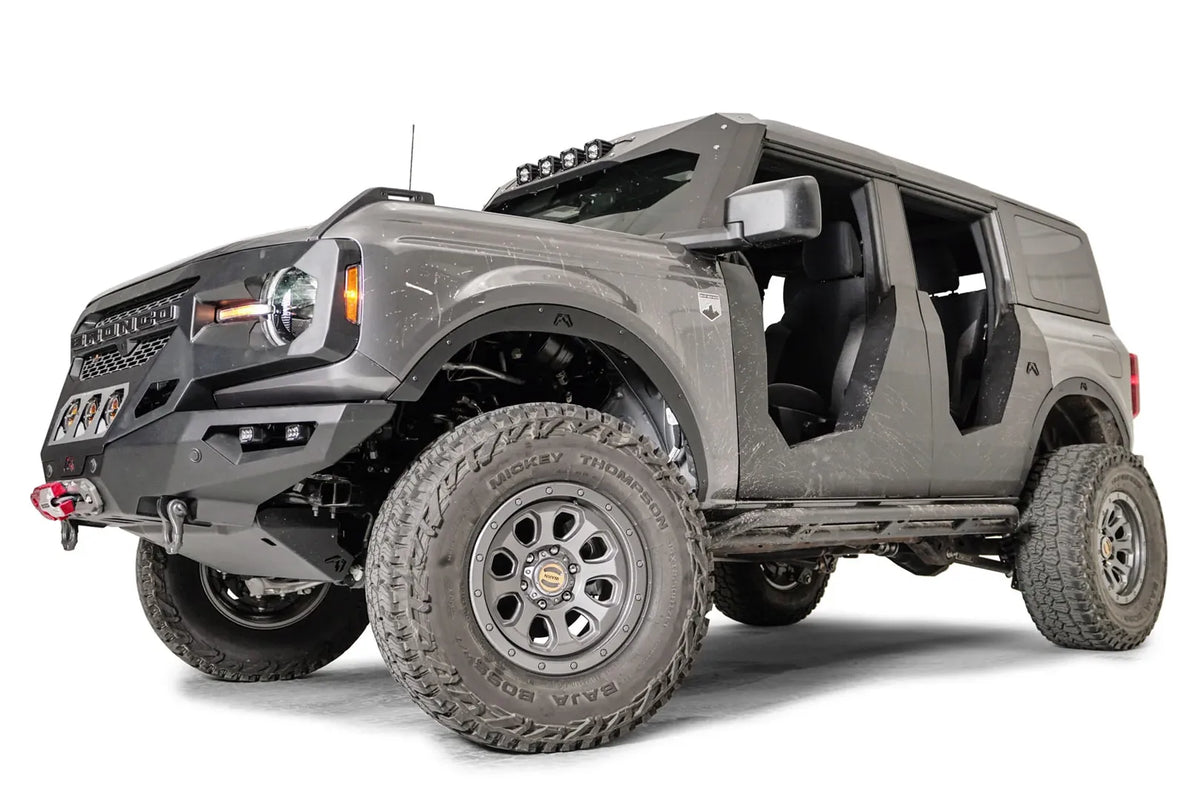 Fab Fours Trail Doors on a lifted gray four-door Ford Bronco, low front driver-side view
