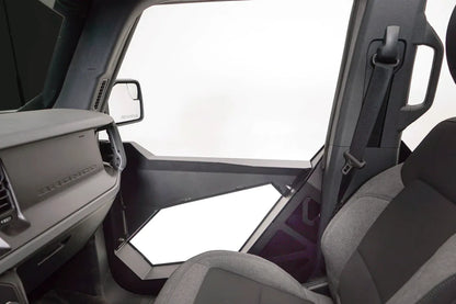 Interior view of a Fab Fours Trail Door Insert on a Ford Bronco passenger door, showing the steel frame and cutout beside the dashboard and seat