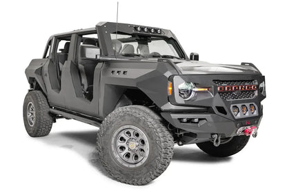 Fab Fours front steel fenders on a lifted gray Ford Bronco with doors removed, passenger-side front three-quarter view, with Fab Fours winch bumper