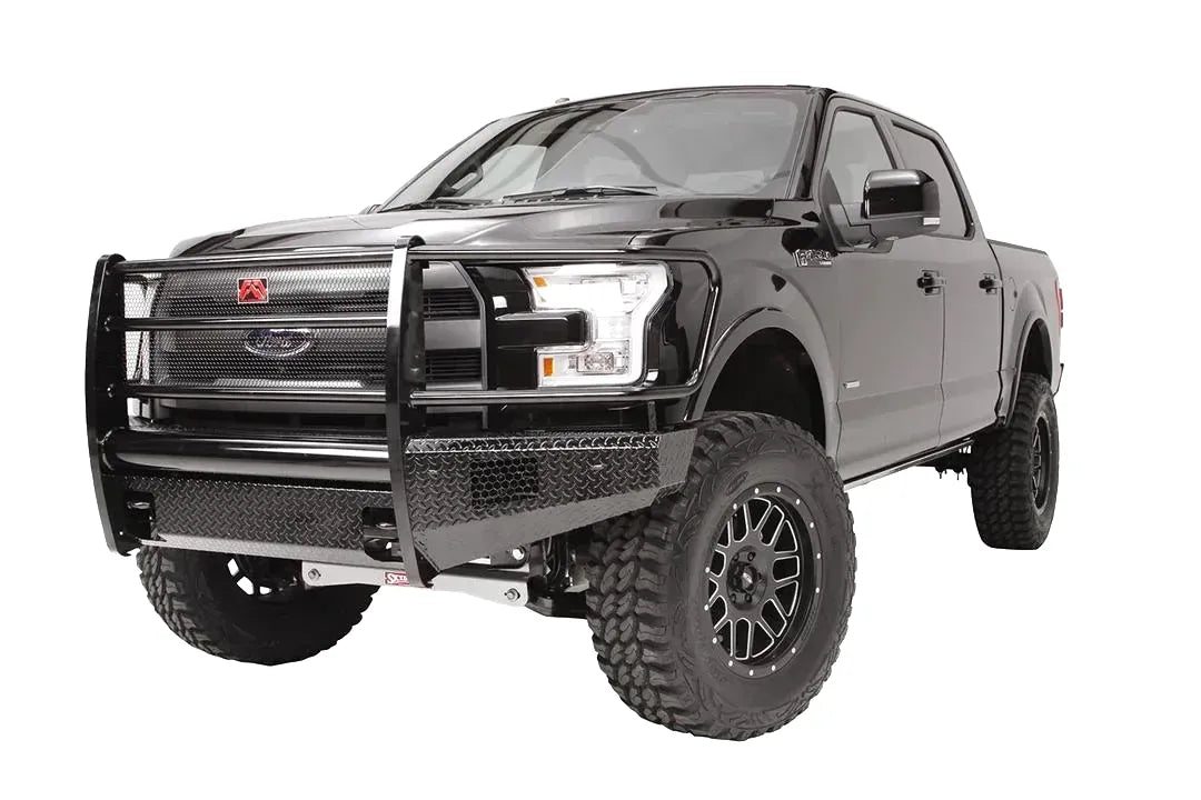 Fab Fours Black Steel front ranch bumper with full guard on a black Ford F-150, front driver-side three-quarter studio view, showing the full grille guard, diamond-plate bumper and wraparound wings