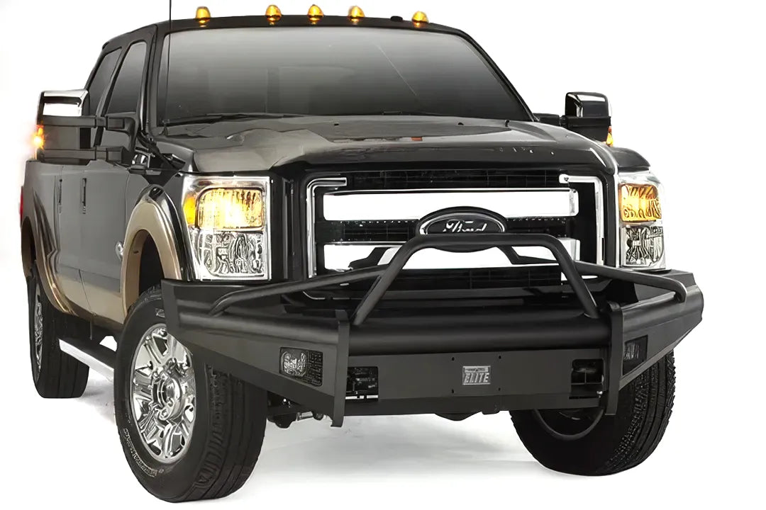 Fab Fours Black Steel Elite front bumper with pre-runner guard on a black two-tone Ford truck, front passenger-side three-quarter studio view, showing the pre-runner hoop, smooth bumper face and fog lights