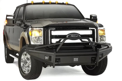Fab Fours Black Steel Elite front bumper with pre-runner guard on a black two-tone Ford truck, front passenger-side three-quarter studio view, showing the pre-runner hoop, smooth bumper face and fog lights