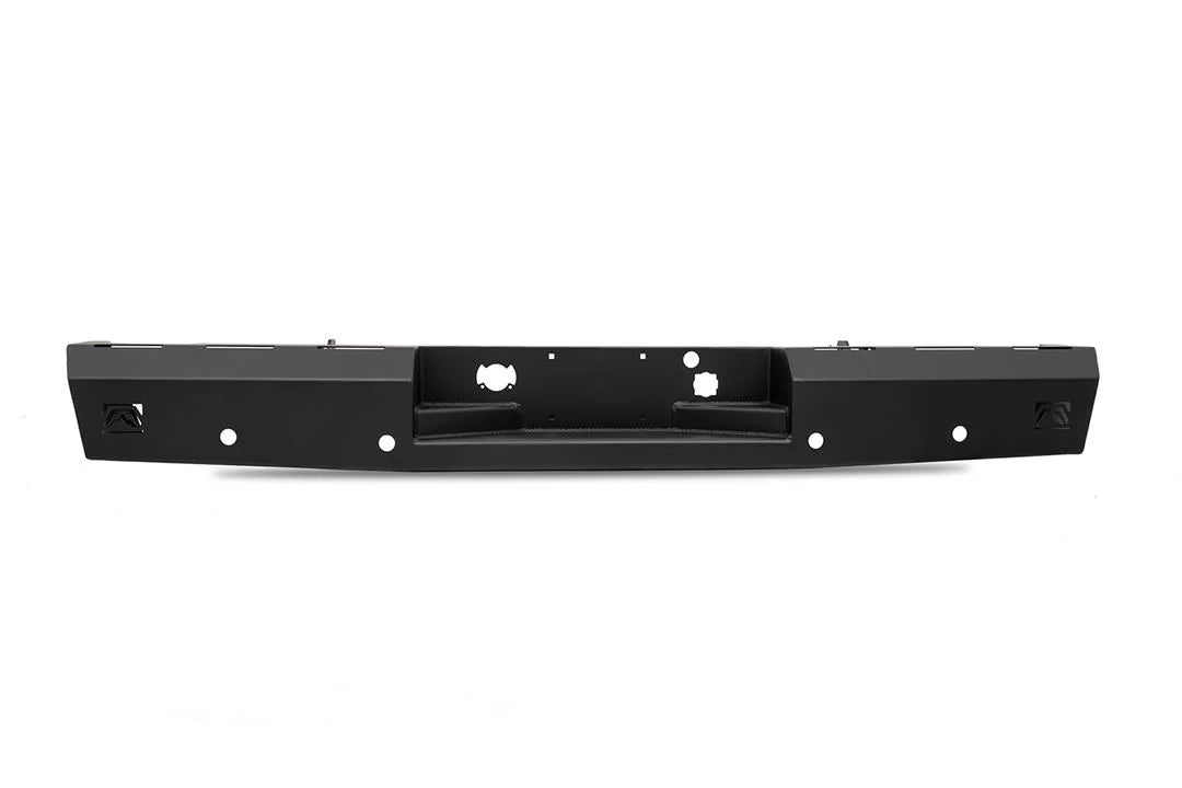 Fab Fours Red Steel rear bumper in black powder coat, rear view, showing the full-width bumper, recessed hitch pocket and light openings