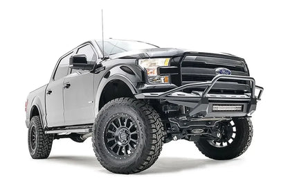 Fab Fours Aero front bumper on a black Ford F-150, front passenger-side three-quarter studio view, showing the tubular hoop, slim bumper frame and light bar