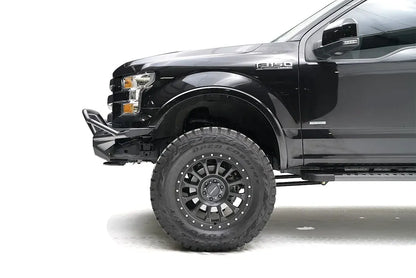 Fab Fours Aero front bumper with pre-runner guard on a black Ford F-150, close-up of the driver-side bumper end, showing the pre-runner tube, slim end cap and tire clearance
