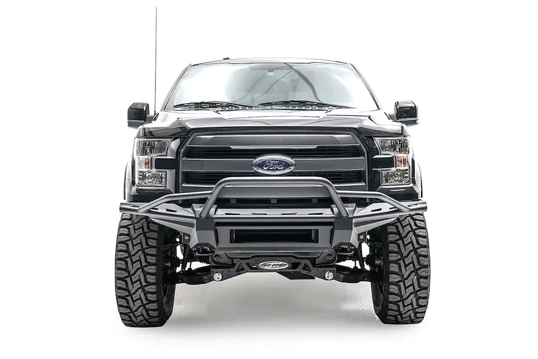 Fab Fours Aero front bumper with pre-runner guard on a black Ford F-150, straight-on front studio view, showing the pre-runner hoop, slim bumper frame and open center section