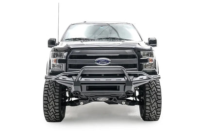 Fab Fours Aero front bumper with pre-runner guard on a black Ford F-150, straight-on front studio view, showing the pre-runner hoop, slim bumper frame and open center section