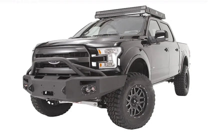 Fab Fours Premium Winch front bumper with pre-runner guard on a black Ford F-150, front driver-side three-quarter studio view, showing the pre-runner hoop, heavy-duty bumper and round fog lights