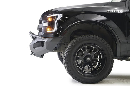 Fab Fours Matrix front bumper with pre-runner guard on a black Ford F-150, close-up of the front corner, showing the pre-runner tube, bumper end and wheel clearance