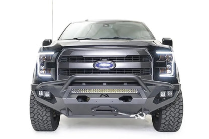 Fab Fours Matrix front bumper with pre-runner guard on a black Ford F-150, straight-on front view, showing the pre-runner hoop, center light bar and winch