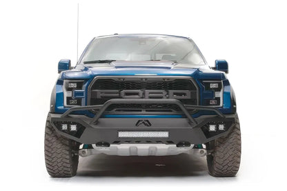 Fab Fours Vengeance front bumper with pre-runner guard on a blue and gray wrapped Ford Raptor, straight-on front view, showing the pre-runner hoop, center light bar and cube light pods