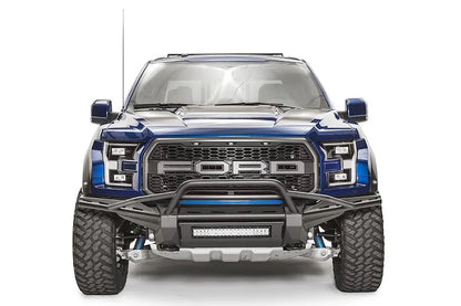 Fab Fours Aero front bumper with pre-runner guard on a blue Ford F-150 Raptor, front view, with center LED light bar