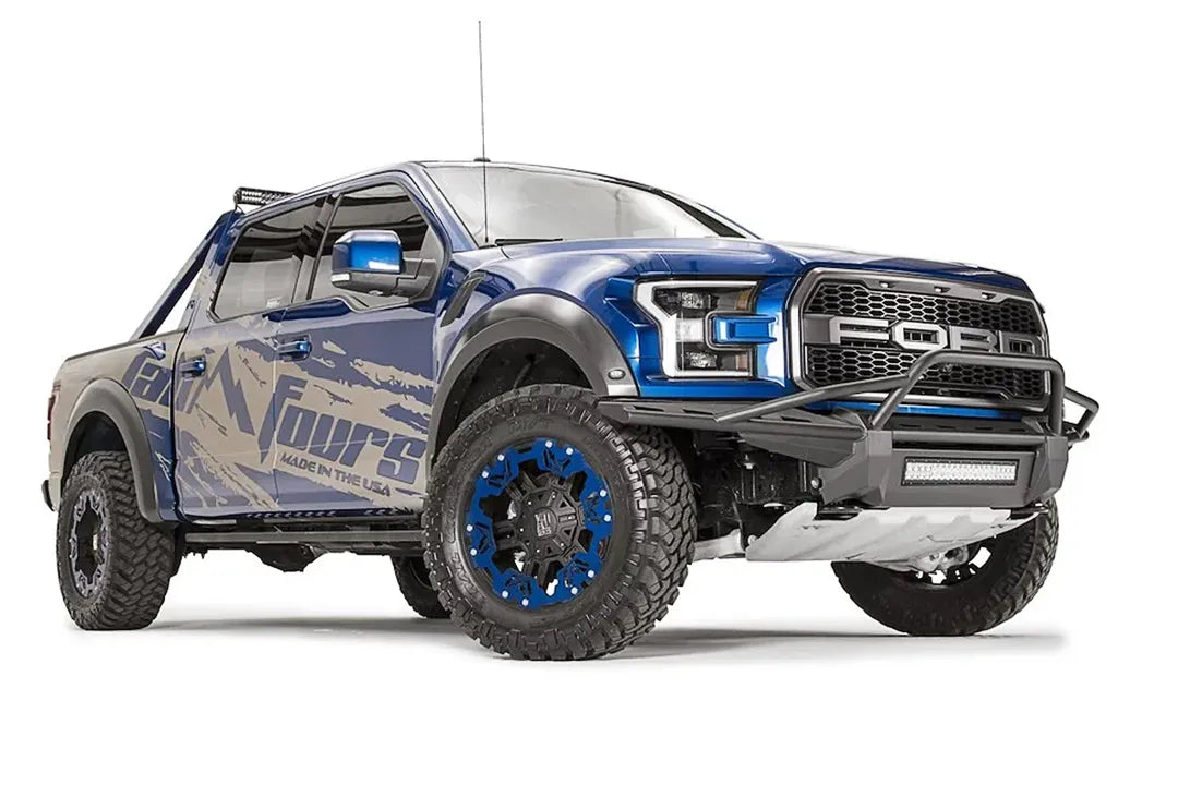 Fab Fours Aero front bumper with pre-runner guard and center LED light bar on a blue Ford F-150 Raptor with Fab Fours wrap, passenger-side front three-quarter view