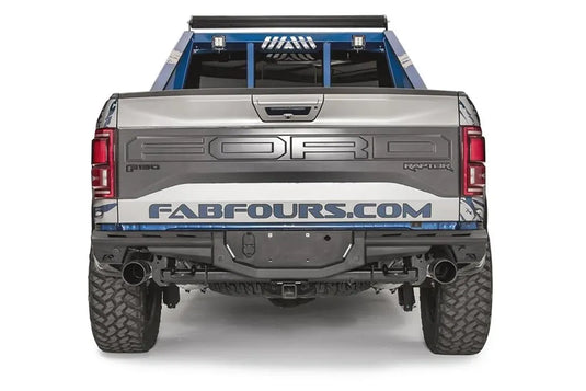 Fab Fours Aero rear bumper on a Ford F-150 Raptor, straight rear view, with center license plate mount, hitch receiver, and dual exhaust tips