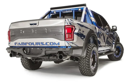 Fab Fours Aero rear bumper on a Ford F-150 Raptor with blue and silver Fab Fours wrap and chase rack, passenger-side rear three-quarter view