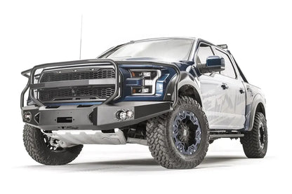 Fab Fours Premium Winch front bumper with full guard on a blue and gray wrapped Ford Raptor, front driver-side three-quarter view, showing the full grille guard, winch recess and round fog lights