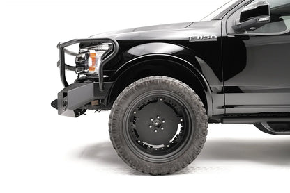 Fab Fours Premium Winch front bumper with full guard on a black Ford F-150, close-up of the front corner, showing the guard upright, bumper end and wheel clearance