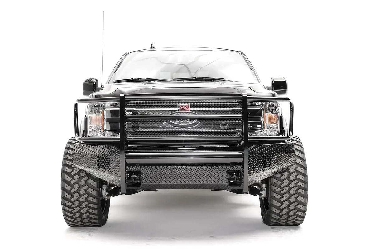 Fab Fours Black Steel front bumper with full guard on a black Ford F-150, straight-on front view, showing the full grille guard, diamond-plate face and center mounts