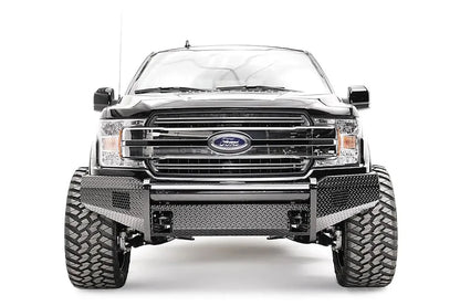 Fab Fours Black Steel front bumper on a black Ford F-150, straight-on front view, showing the diamond-plate face, tube top rail and bumper wings