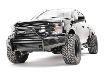 Fab Fours Black Steel front bumper with pre-runner guard on a black Ford F-150, front driver-side three-quarter view, showing the pre-runner hoop, diamond-plate face and bumper wings