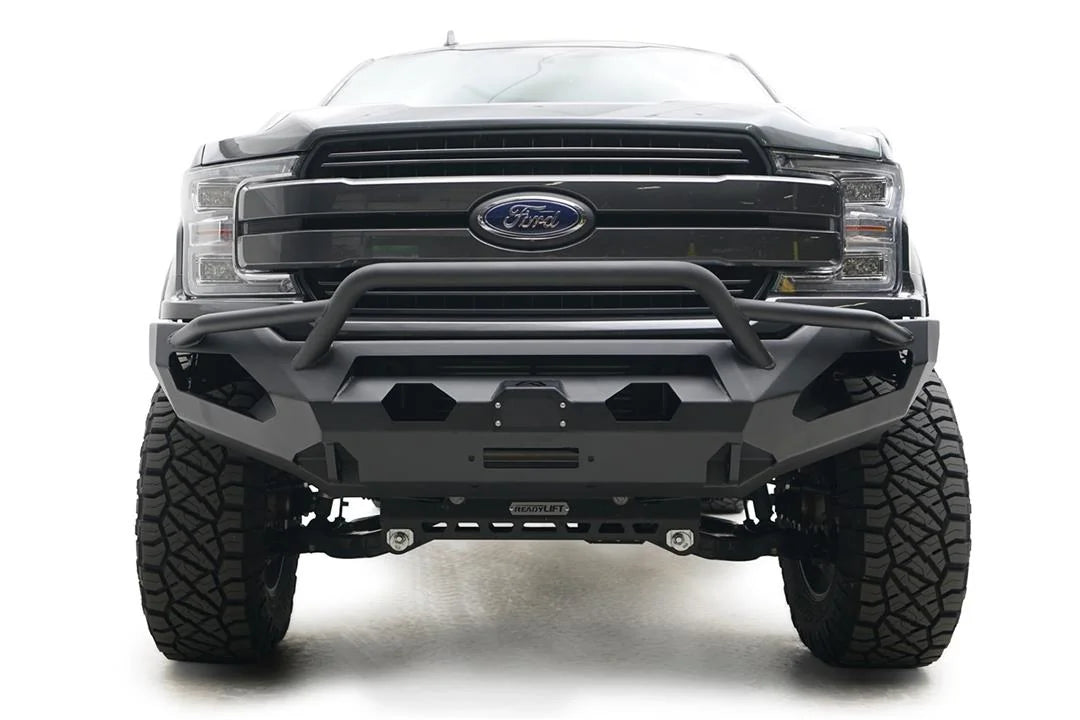 Fab Fours Matrix front bumper with pre-runner guard on a gray Ford F-150, straight-on front view, showing the pre-runner hoop, center winch and light cutouts