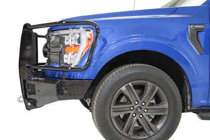Fab Fours Black Steel front bumper with full guard on a blue Ford F-150, close-up of the front corner, showing the guard upright and diamond-plate bumper end