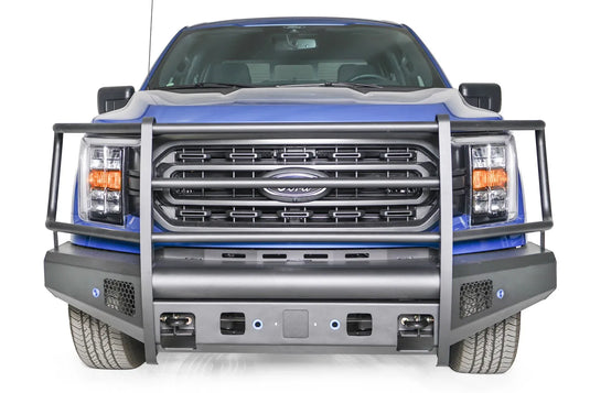 Fab Fours Black Steel Elite front bumper with full guard on a blue Ford F-150, straight-on front view, showing the full grille guard, smooth bumper face and mesh vents