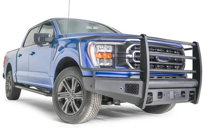 Fab Fours Black Steel Elite front bumper with full guard on a blue Ford F-150, front passenger-side three-quarter view, showing the full grille guard, mesh vent and bumper end