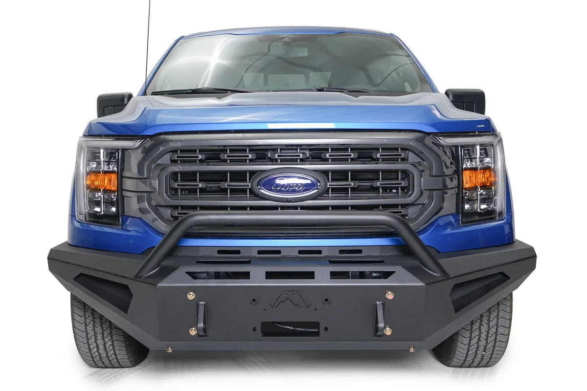 Fab Fours Red Steel front bumper with pre-runner guard on a blue Ford F-150, straight-on front view, showing the pre-runner hoop, logo cutout and shackle mounts