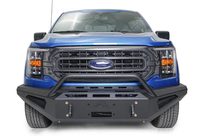 Fab Fours Red Steel front bumper with pre-runner guard on a blue Ford F-150, straight-on front view, showing the pre-runner hoop, logo cutout and shackle mounts