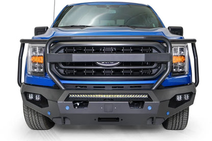 Fab Fours Matrix front bumper with full guard on a blue Ford F-150, straight-on front view, showing the full grille guard, center light bar and cube light pods