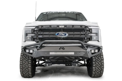 Fab Fours Vengeance front bumper with pre-runner guard on a white Ford F-150, straight-on front view, showing the pre-runner hoop, center light bar and cube light pods
