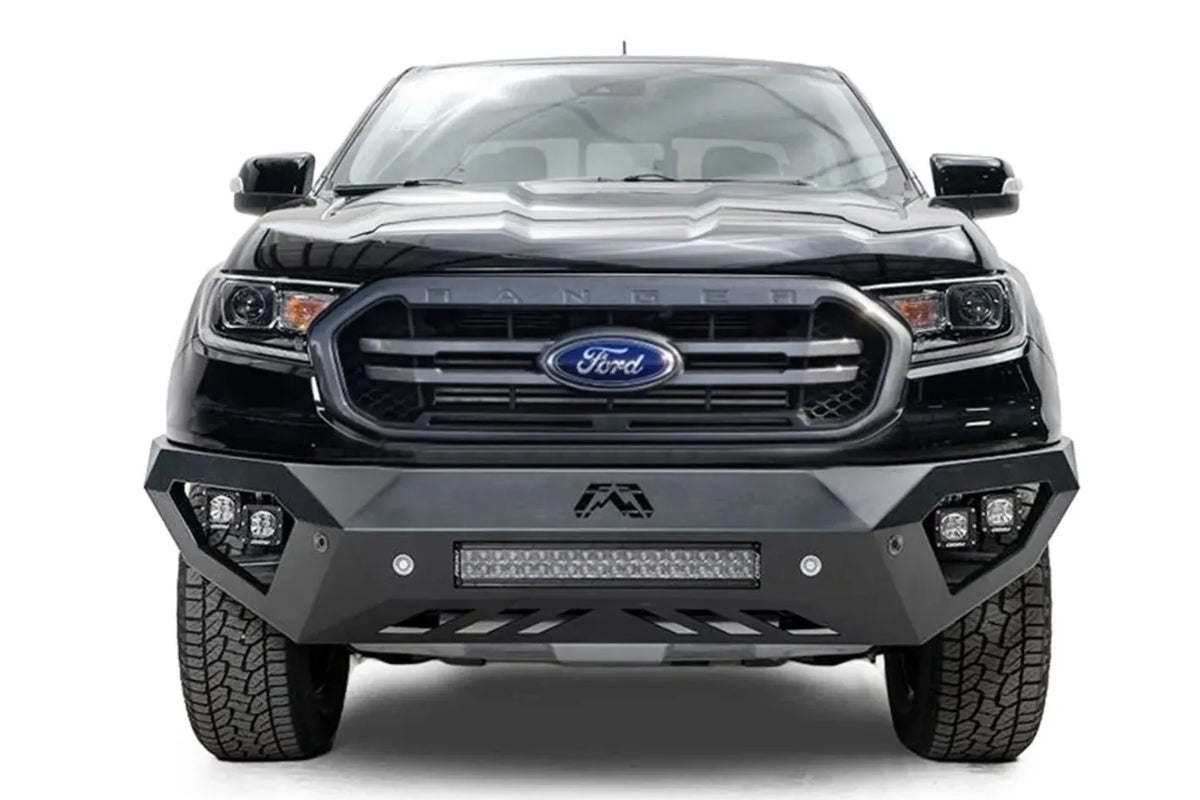 Fab Fours Vengeance front bumper on a black Ford Ranger, straight-on front view, showing the center light bar, cube light pods and Fab Fours logo