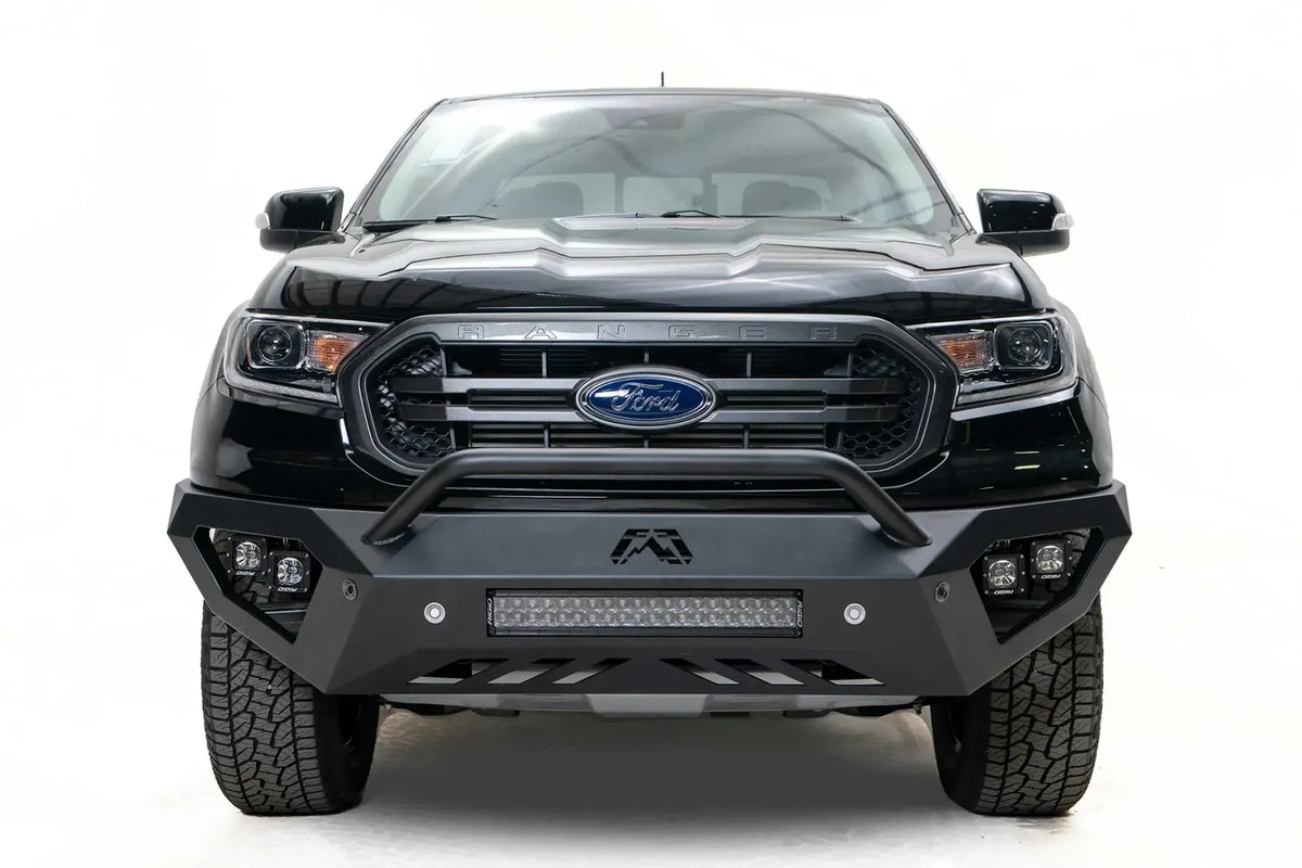 Fab Fours Vengeance front bumper with pre-runner guard on a black Ford Ranger, straight-on front view, showing the pre-runner hoop, center light bar and cube light pods