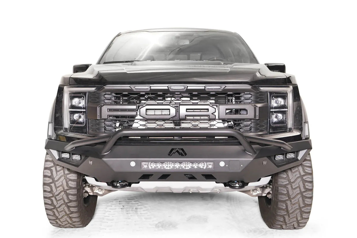 Fab Fours Vengeance front bumper with pre-runner guard on a dark gray Ford Raptor, straight-on front view, showing the pre-runner hoop, center light bar and cube light pods